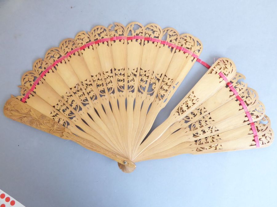 An early 20th century pierced wooden fan decorated with various Swiss costume, together with a - Image 7 of 10