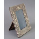 A fine Art Nouveau style and period hallmarked silver photograph frame of easel form; decorated in