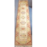 A hand-knotted Hamadan-style runner; central cream rectangle with stylised differing coloured