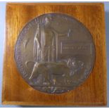 A WWI Memorial Plaque to Albert Stickley (1889-1915) (the wooden frame 15.5cm square). The son of