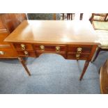 A mid-19th century mahogany writing table; thumbnail-moulded top above an arrangement of five