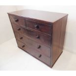 An early 19th century mahogany chest; reeded edge top above two half-width and three full-width