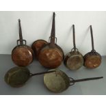 Six 19th and early 20th century iron-handled copper saucepans and one other piece (7)