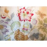 A pair of linen-effect curtains in a pattern of flowers, fruit, birds and butterflies, with matching