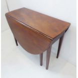 A late 18th century oval mahogany drop-leaf table; single flush end-drawer and raised on square