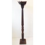 A late 19th century carved wood torchère stand in Classical style; raised on square spreading