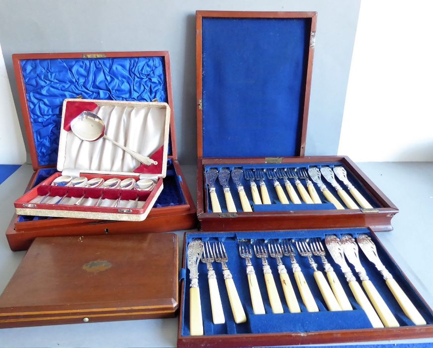 A late 19th / early 20th century mahogany-cased three-tray set of silver-plated fish eaters and