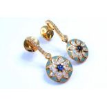 A pair of gem-set and enamel ear pendants; each comprising a pale blue-enamelled circular plaque