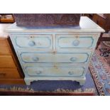 A painted shabby-chic-style 19th century pine chest; the overhanging moulded top above two half-