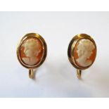 A pair of 9-carat yellow gold earrings set with carved oval cameos