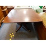 A George IV period (circa 1825) mahogany tilt-top breakfast table; the rectangular top with