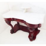 A mid-19th century marble-topped mahogany washstand; the galleried top with central shelf above a