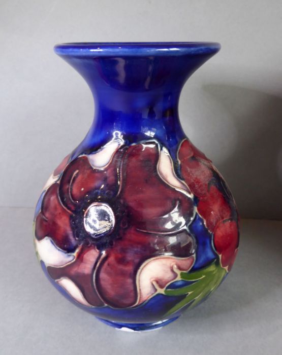 A small Moorcroft Pottery tube-lined bottle vase; of baluster-form and hand-decorated with anemones, - Image 2 of 4