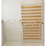 A Victorian-style single bedstead; white-painted with spherical brass finials (the headboard 93cm