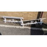 A pair of white-painted ironwork wall-hanging shelves (100cm wide)