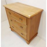 An early 20th century pine chest; the slightly overhanging thumbnail moulded top above three full-