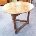 An 18th century style (made up) circular oak cricket table; the thumbnail-moulded top above three