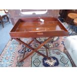 A large 19th century two-handled mahogany butler's tray on folding stand (the tray 76cm x 50.5cm