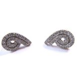 A pair of diamond-set double scroll ear clips, set with brilliant-cut diamonds to the 9-carat