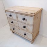 A 19th century washed-pine chest; moulded top above two half-width and two full-width graduated