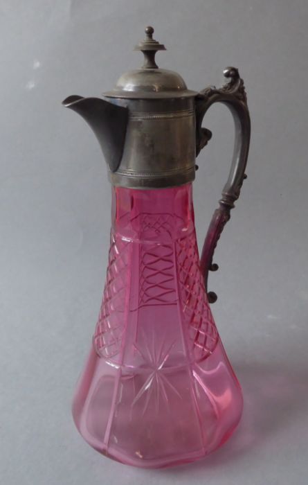 A Victorian cut-glass cranberry claret jug with silver-plated mounts