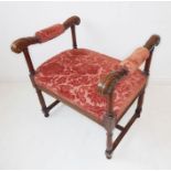 A 19th century walnut stool in earlier 17th century style; the two handles upholstered to the