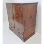 A good Sheraton period mahogany side cabinet; the crossbanded top above two figured doors banded