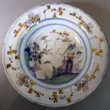 An attractive early 18th century English Delftware soup dish; the border decorated with sprigs and