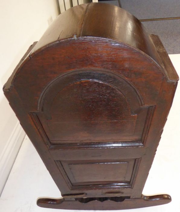 An 18th century oak child's cot; the hood above various fielded panels (replaced rockers) (97cm - Image 8 of 10