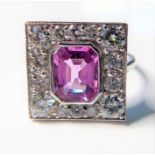 An 18-carat white-gold pink sapphire and diamond cluster ring