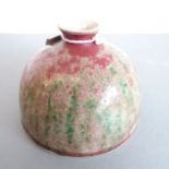 Qing Dynasty - a Chinese ceramic water pot. The small, circular, waisted neck above a mottled red,