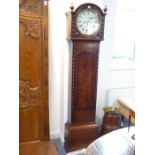 An early 19th century mahogany-cased eight-day longcase clock: the twelve-inch white enamel dial