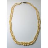 A two row necklace of graduated cultured pearls measuring 2.5mm-8.0mm approx. in diameter to the