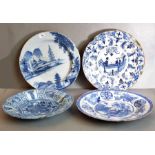 Delft - four large dishes 17th and 18th century, one with an attractive watery landscape, another in