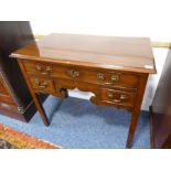 An 18th century mahogany lowboy; the moulded top above a single full-width drawer probably retaining