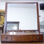 A large early 19th century bow-fronted mahogany and boxwood-strung toilet mirror; the tapering