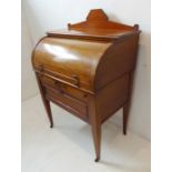 An early 20th century mahogany cylinder bureau; satinwood-crossbanded and boxwood strung, the