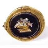 A small 19th century Grand Tour style gilt-framed (probably Pinchbeck) micro mosaic brooch; the