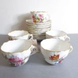 Five continental porcelain cups and nine matching saucers. Each individually decorated in enamels