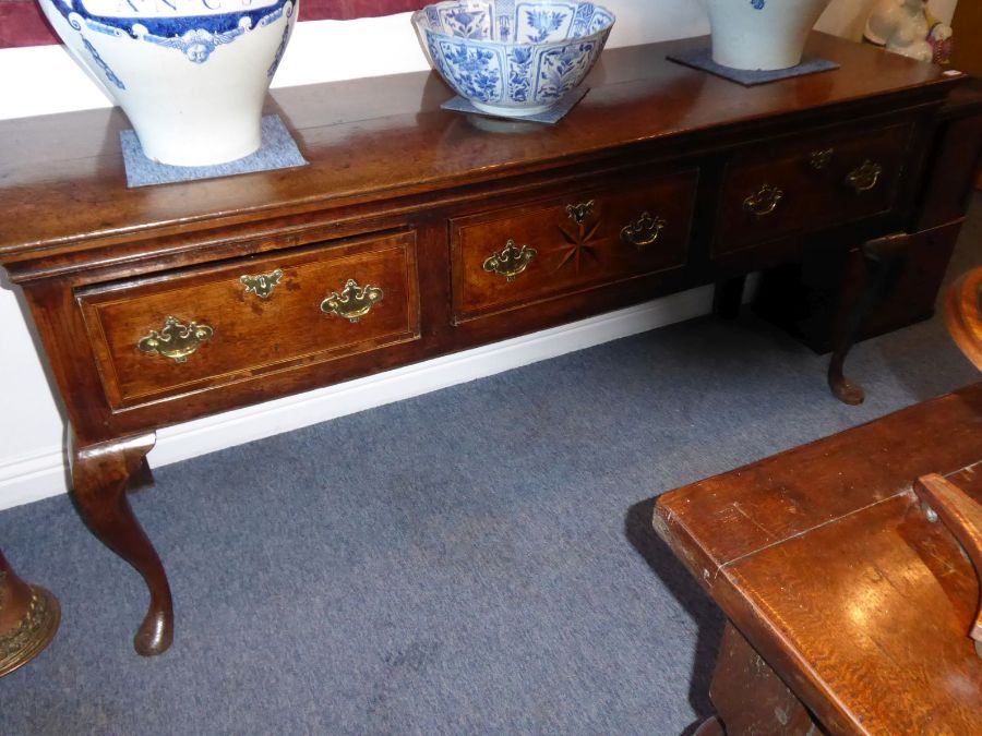A good mid 18th century oak dresser base; the moulded top above three frieze drawers, the central - Image 2 of 8