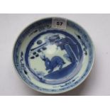 A small 17th / 18th century Chinese porcelain dish. Hand-decorated in underglaze blue with a hare