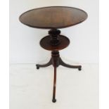 A late 18th / early 19th century circular oak-topped drinking-table; the slightly dished top above a