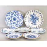 Delft - three English plates each painted with a flowering tree above water; two plates with brown