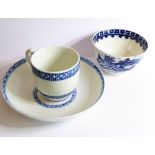 A late 18th/early 19th century Tournai blue and white ribbed cup and saucer; the saucer with painted