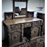 An unusual late 19th century colonial-style pedestal oak sideboard: the central mirror with a