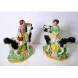 An opposing pair of 19th century Staffordshire figures; two girls riding upon the backs of black and