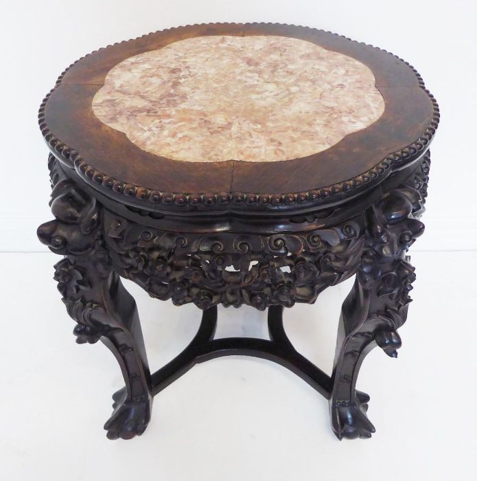 A 19th century Chinese carved hardwood and marble-topped jardinière stand; the gadrooned top with - Image 2 of 9