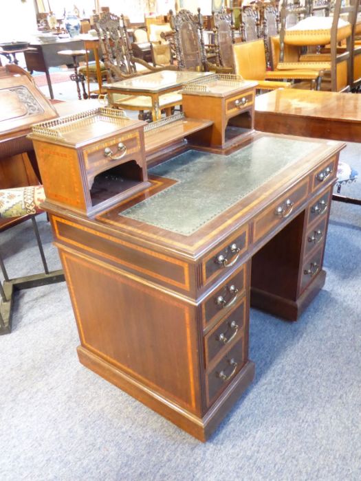 A good Edwardian period mahogany and satinwood pedestal writing desk; the superstructure with gilt-
