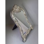 A late 19th century silver-mounted lady's easel-style dressing table mirror: elaborate and ornate