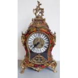 A large Louis XV style (modern) eight-day bracket clock. Red-and-black faux tortoise-shell, brass-